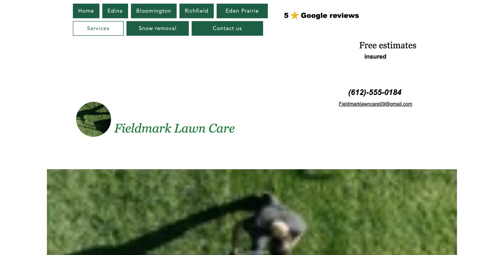 The original Fieldmark Lawn Care homepage: two rows of nav buttons, scattered contact details, and a blurry photo